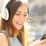 happy-girl-listening-music-with-headphones