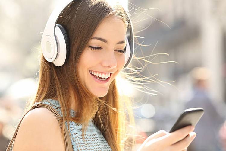 happy-girl-listening-music-with-headphones