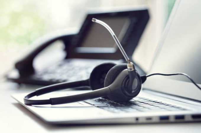 headset-headphones-telephone-and-laptop-in-call-center